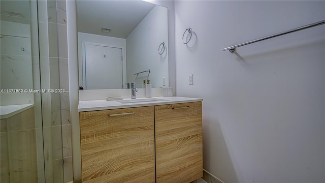 bathroom featuring vanity with extensive cabinet space