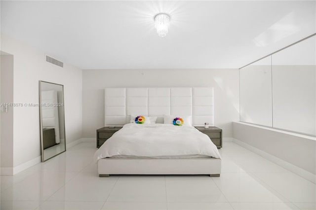 bedroom with light tile floors