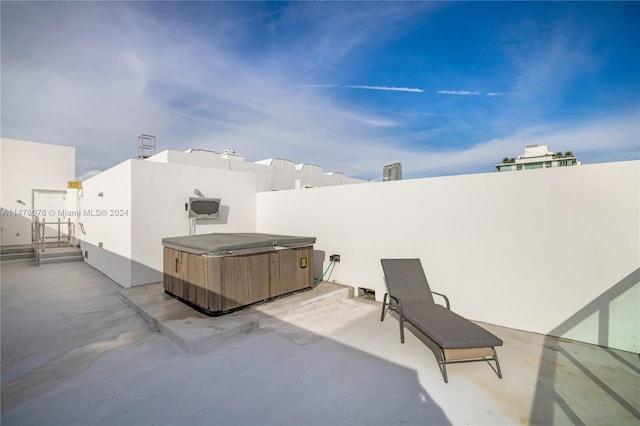 view of patio / terrace featuring a hot tub