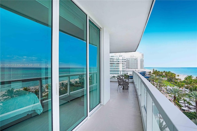 balcony featuring a water view