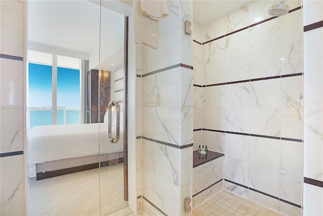 bathroom with tiled shower