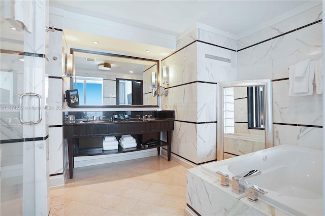 bathroom with tile flooring, separate shower and tub, and vanity