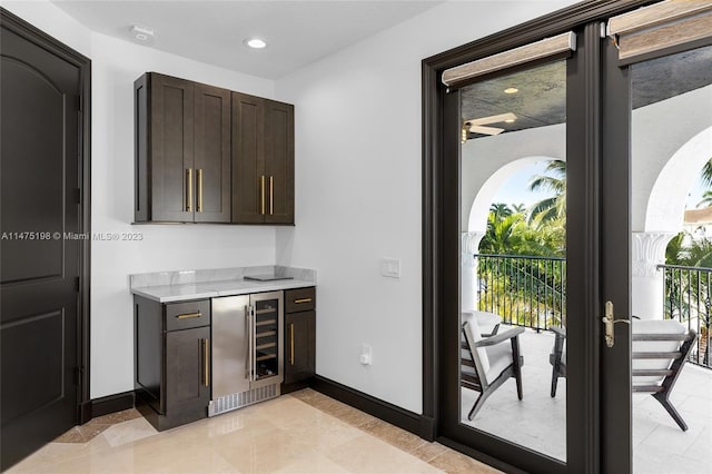 bar featuring wine cooler, recessed lighting, and baseboards