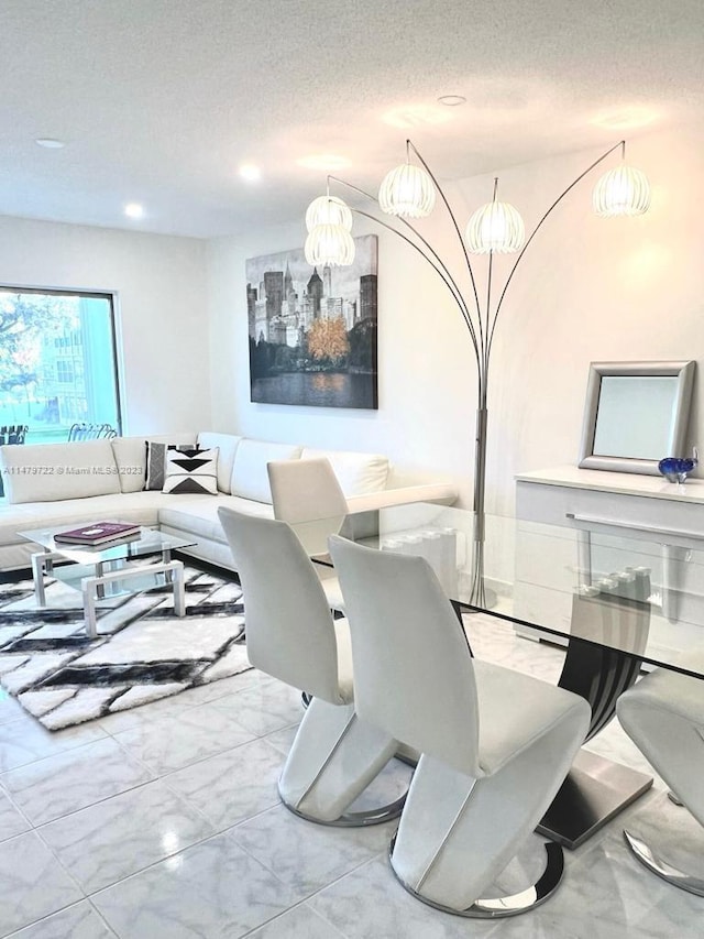 dining space with a textured ceiling