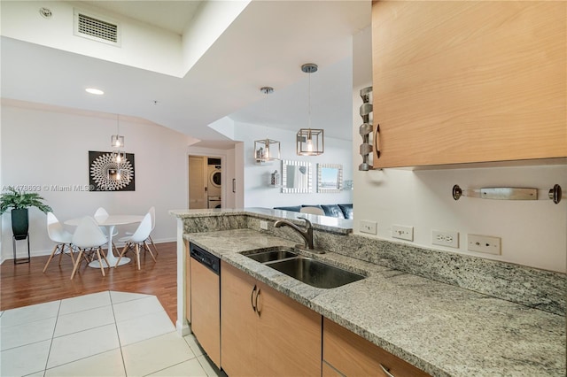 2775 NE 187th St Unit 516, Aventura, FL 33180 - kitchen with a sink, visible vents, light stone countertops, dishwasher, and hanging light fixtures