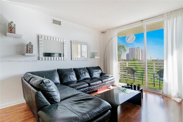 2775 NE 187th St Unit 516, Aventura, FL 33180 - living area featuring visible vents, wood finished floors, and floor to ceiling windows