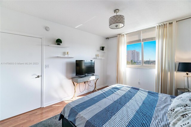 2775 NE 187th St Unit 516, Aventura, FL 33180 - bedroom with wood finished floors and baseboards