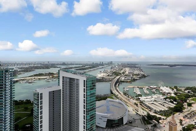 birds eye view of property with a water view