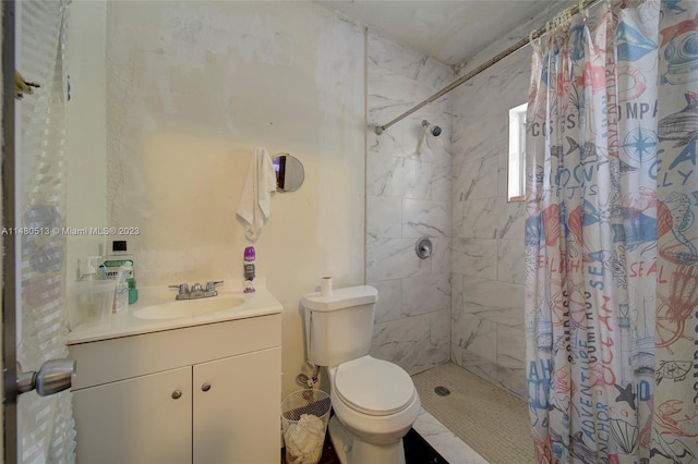 bathroom with vanity, curtained shower, and toilet