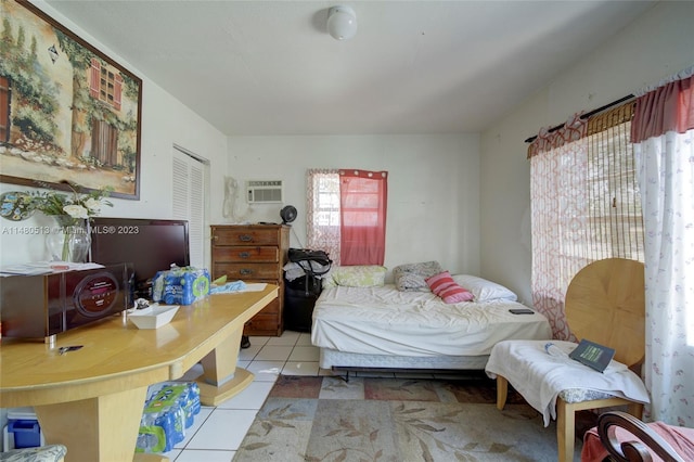 tiled bedroom with an AC wall unit