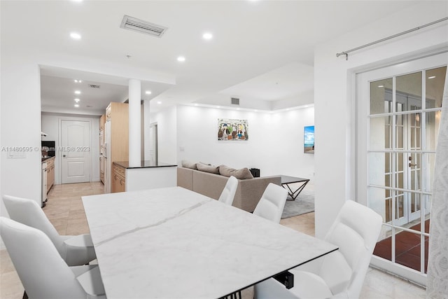 dining area with light tile floors