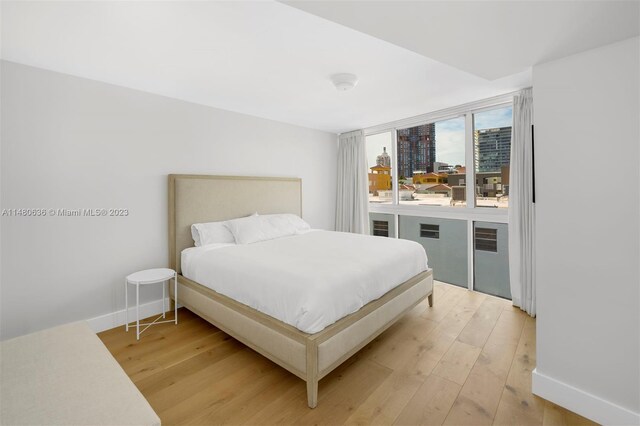 bedroom featuring light wood-type flooring