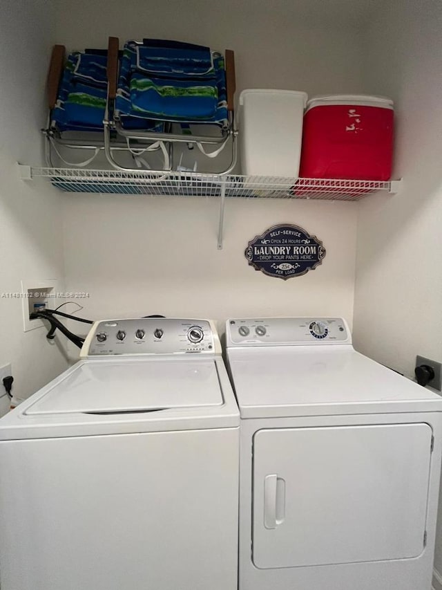 laundry area featuring washing machine and clothes dryer