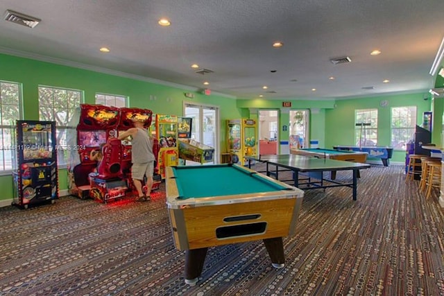 rec room featuring a textured ceiling, billiards, and crown molding