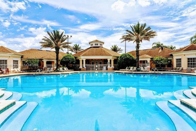 view of swimming pool with a patio