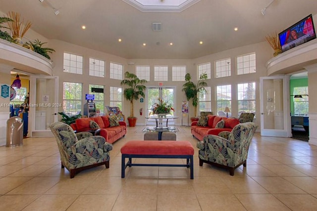 living room featuring light tile patterned floors and a healthy amount of sunlight