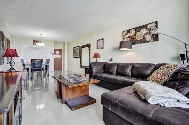 living room featuring a textured ceiling