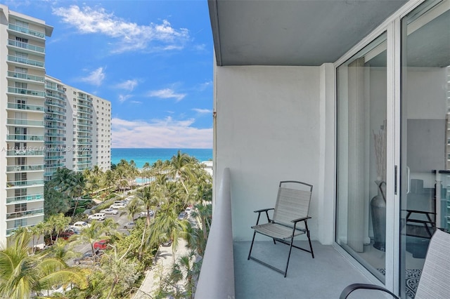 balcony featuring a water view