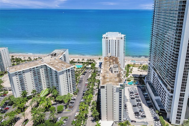 bird's eye view featuring a view of the beach and a water view