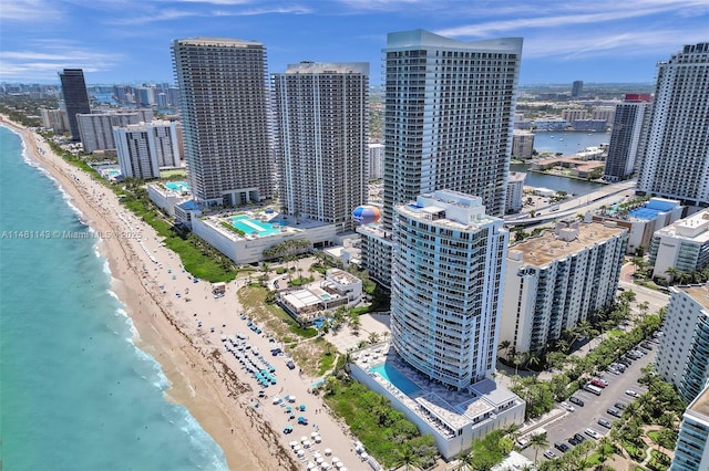 drone / aerial view with a water view and a view of the beach