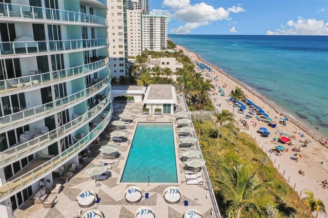 aerial view featuring a view of the beach and a water view