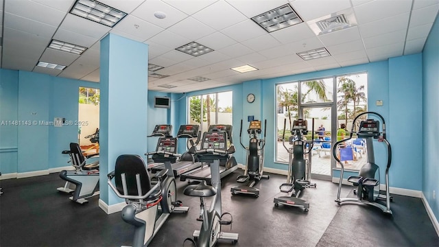 workout area featuring a paneled ceiling