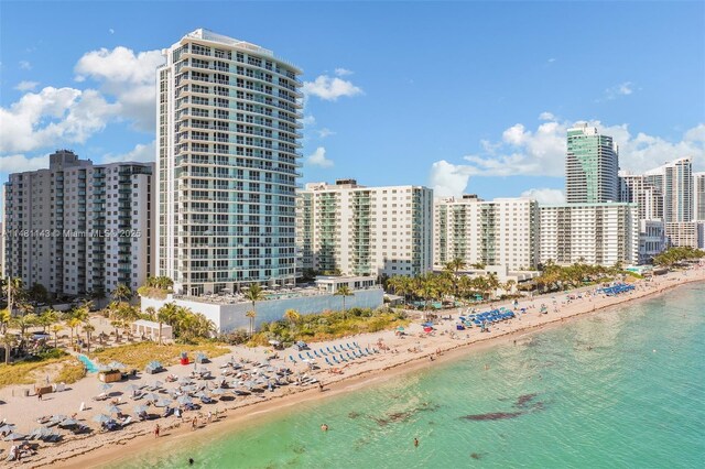 bird's eye view with a beach view and a water view