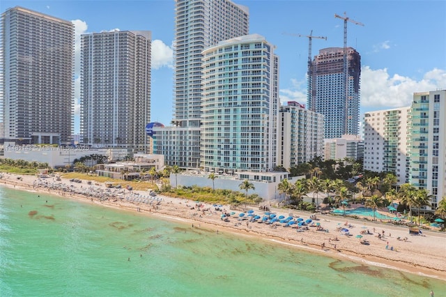 property's view of city featuring a view of the beach and a water view