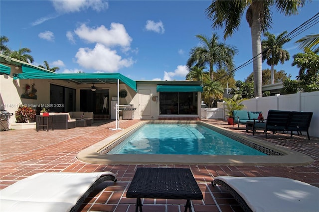 view of pool featuring outdoor lounge area, ceiling fan, and a patio