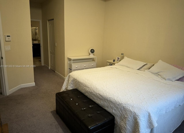 bedroom with dark colored carpet