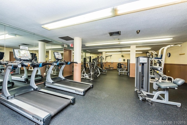 workout area featuring a textured ceiling