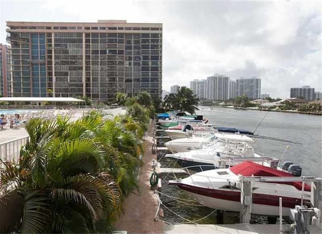 view of parking / parking lot with a water view