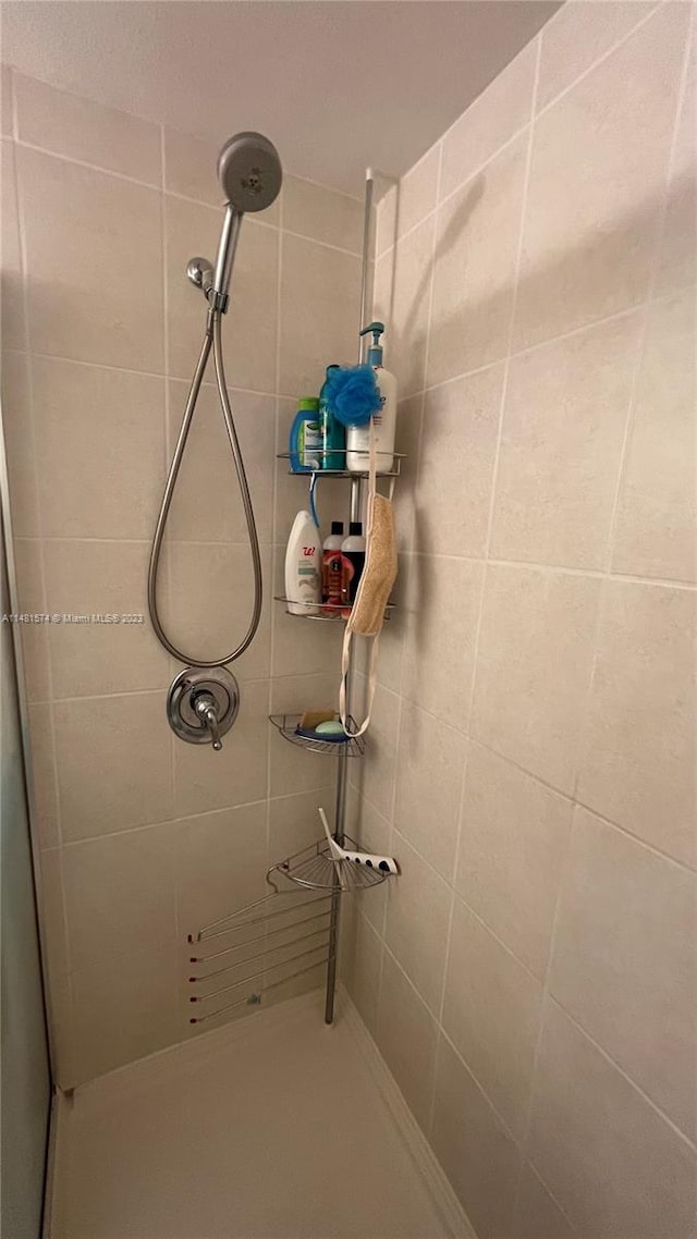 bathroom with tiled shower