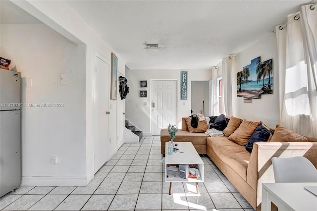 living room featuring light tile floors