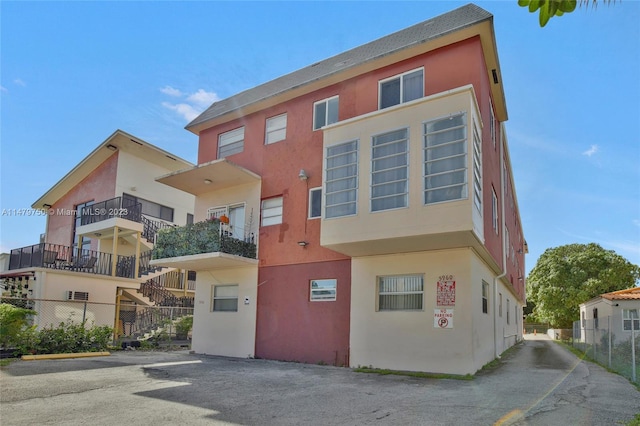 view of front of home with a balcony