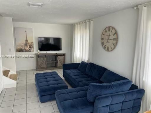 living room with light tile flooring