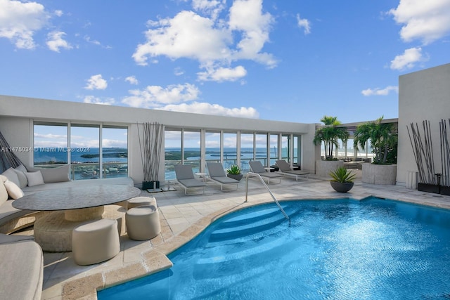 view of swimming pool with a patio area