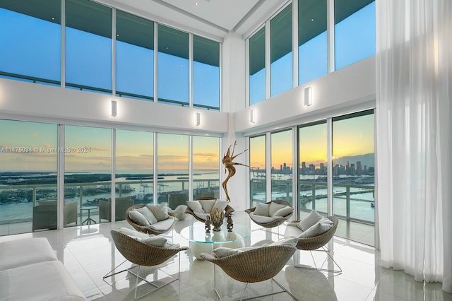 interior space featuring a wealth of natural light and a water view