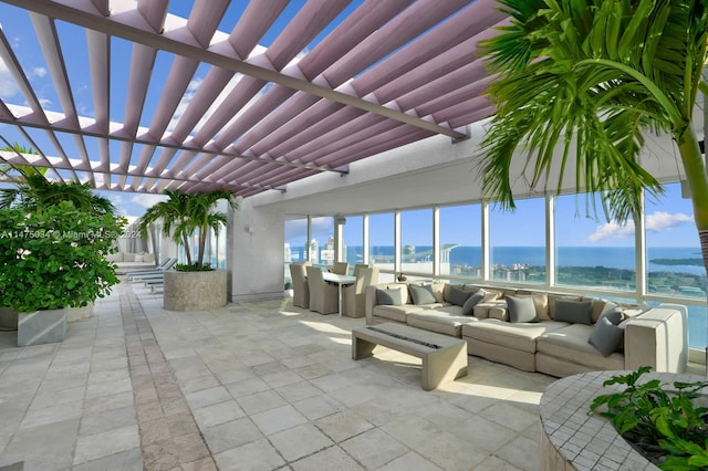 view of patio / terrace with a pergola, outdoor lounge area, and a water view