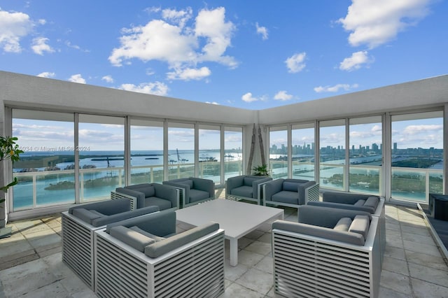 view of patio / terrace featuring outdoor lounge area and a water view