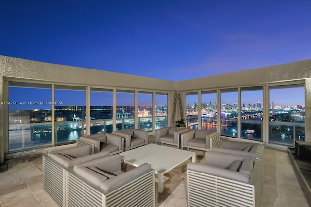 patio terrace at dusk with an outdoor hangout area