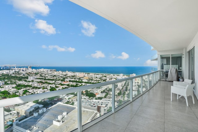 balcony featuring a water view