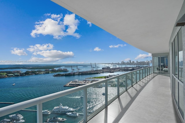 balcony featuring a water view