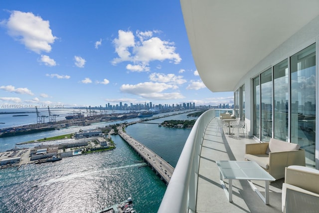 balcony featuring a water view