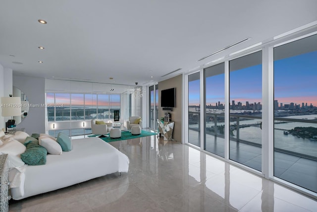 tiled living room featuring expansive windows