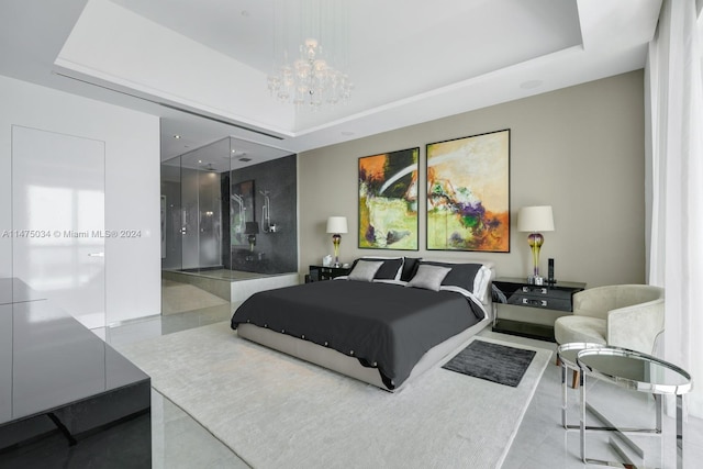 bedroom featuring a tray ceiling and an inviting chandelier