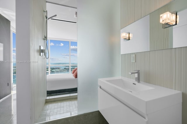 bathroom with tile flooring, a chandelier, and large vanity