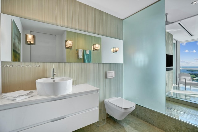 bathroom featuring vanity, toilet, and tile floors