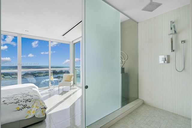 bathroom featuring tile floors, a shower, and a water view