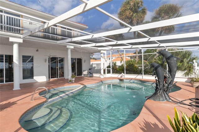 view of swimming pool featuring a patio and a lanai